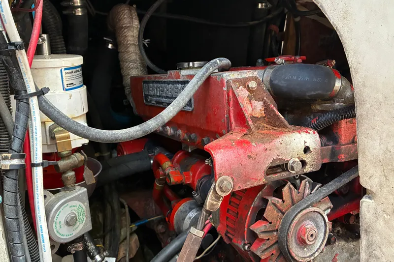 Slide: The Image of Engine compartment of a 1966 Hinckley Bermuda 40 MKIII sailboat, featuring a red Westerbeke engine. - 58