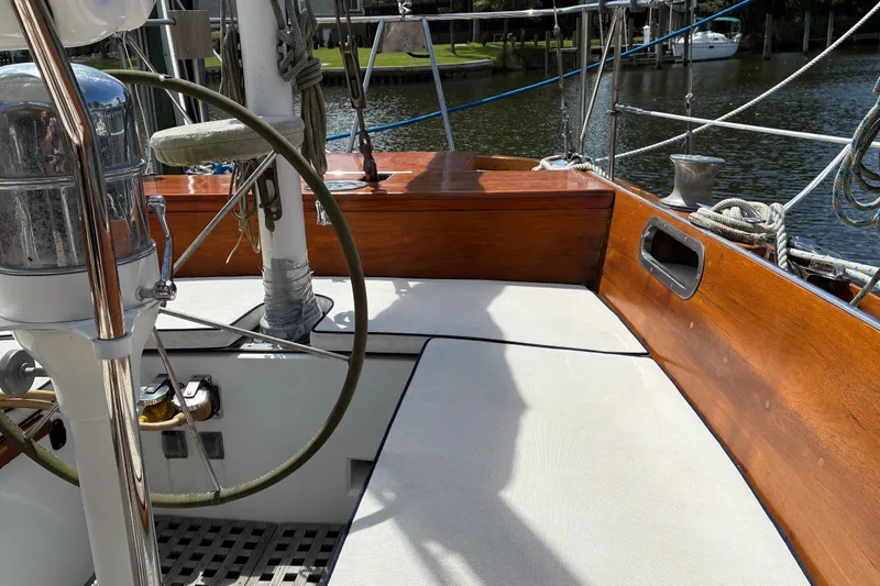 Slide: The Image of Cockpit of 1966 Hinckley Bermuda 40 MKIII sailboat with wooden trim and steering wheel. - 62