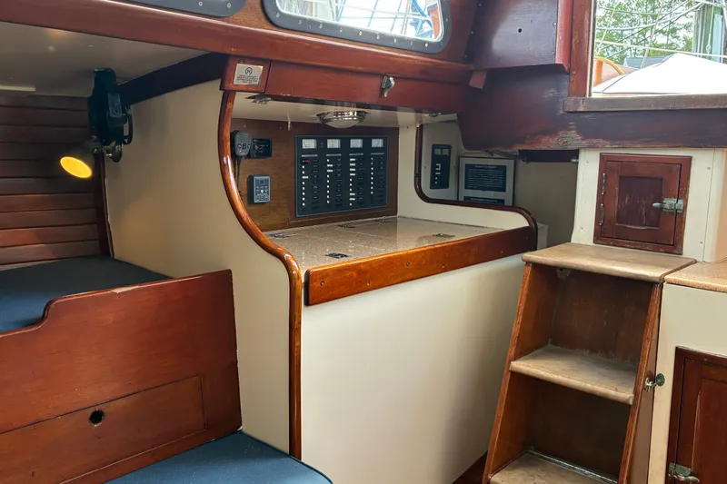 Slide: The Image of Interior of 1966 Hinckley Bermuda 40 MKIII sailboat with wooden cabinetry and control panel. - 20