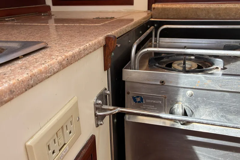 Slide: The Image of Hinckley Bermuda 40 MKIII 1966 yacht kitchen with stove and countertop detail. - 30