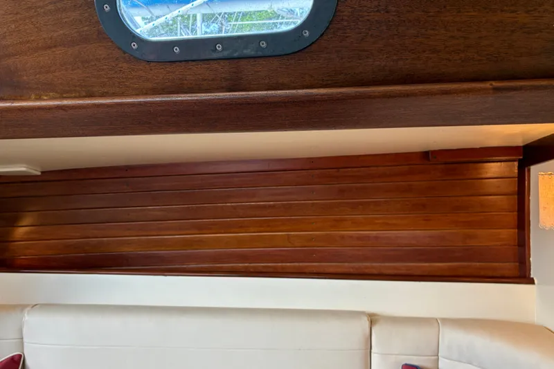 Slide: The Image of Interior of 1966 Hinckley Bermuda 40 MKIII with wooden paneling and porthole window. - 38