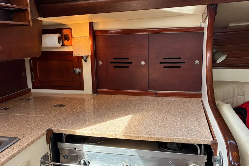 Slide: The Image of Hinckley Bermuda 40 MKIII 1966 yacht interior with wooden cabinets and countertop. - 28