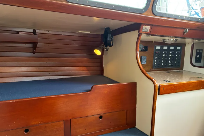 Slide: The Image of Interior of 1966 Hinckley Bermuda 40 MKIII sailboat with wooden cabinetry and control panel. - 21
