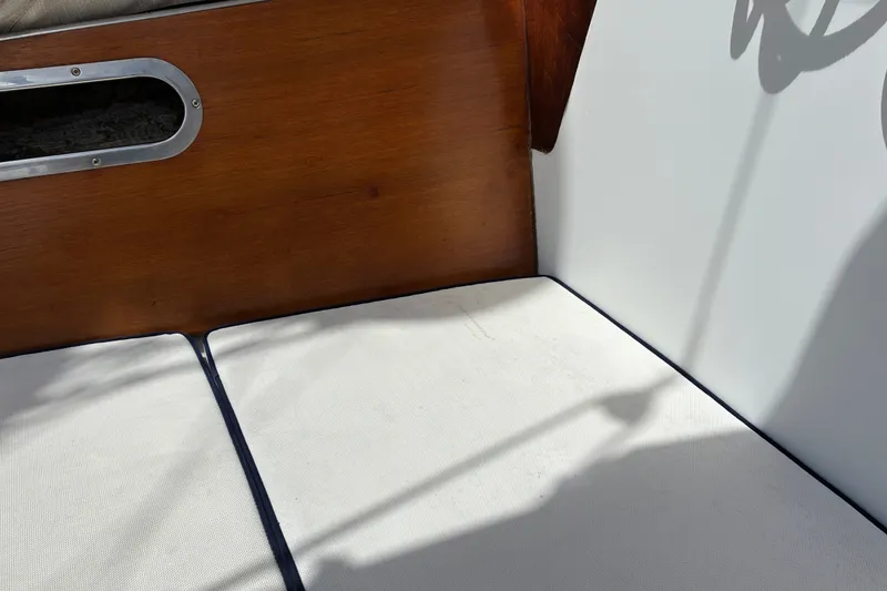 Slide: The Image of Interior of 1966 Hinckley Bermuda 40 MKIII with wooden paneling and white cushions. - 65