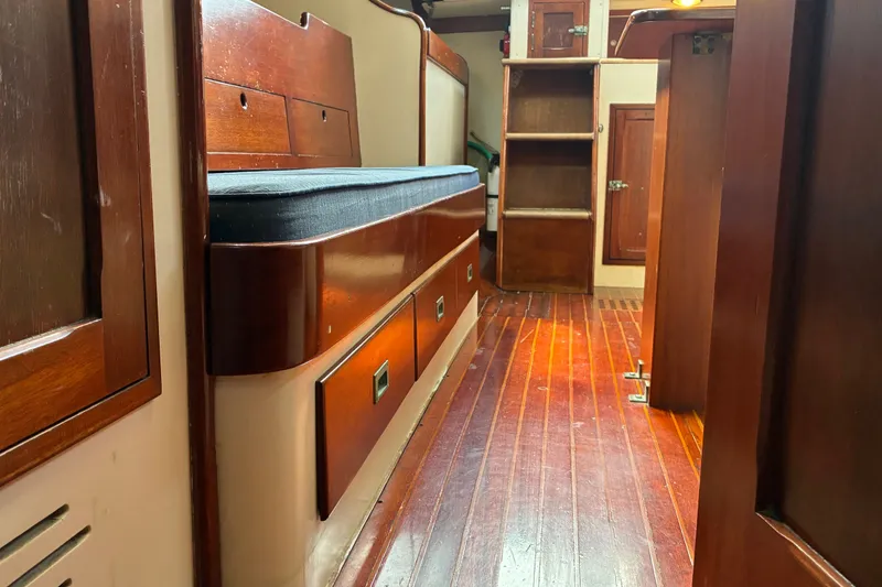 Slide: The Image of Interior of 1966 Hinckley Bermuda 40 MKIII sailboat with wooden cabinetry and flooring. - 42