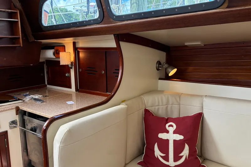 Slide: The Image of Interior of 1966 Hinckley Bermuda 40 MKIII with cozy seating and nautical decor. - 31