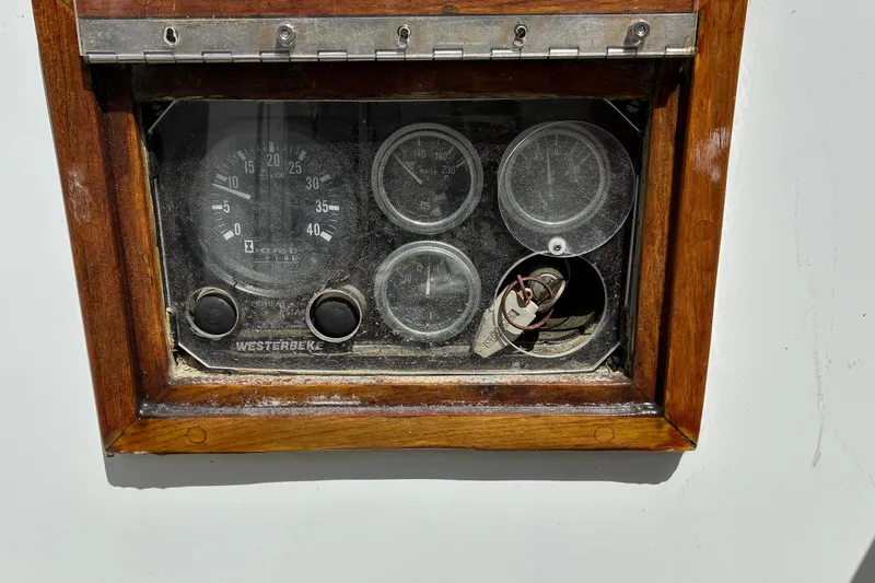 Slide: The Image of Vintage Hinckley Bermuda 40 MKIII 1966 boat dashboard with gauges and ignition key. - 66