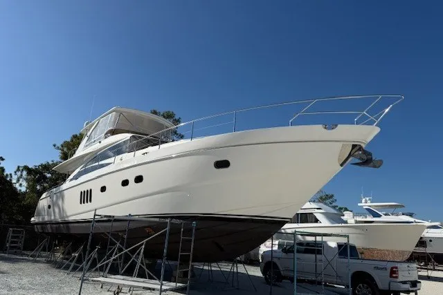 Slide: The Image of 2007 Princess 67 Flybridge Motor Yacht on stands, clear sky background. - 39