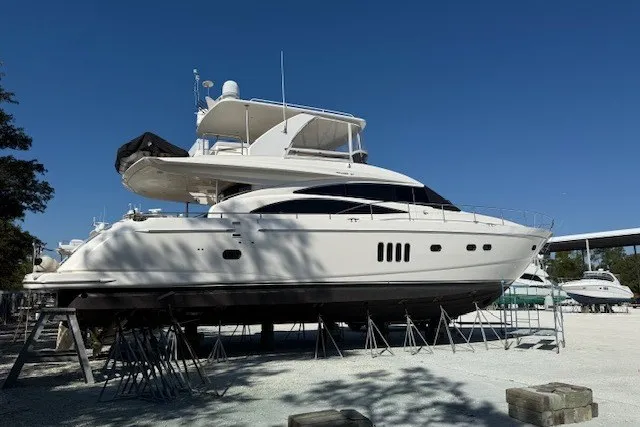 Slide: The Image of 2007 Princess 67 Flybridge Motor Yacht on stands under clear blue sky. - 43