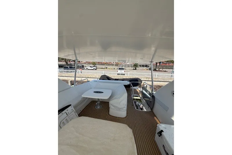 Slide: The Image of Flybridge view of 2007 Princess 67 Motor Yacht with seating and table. - 19