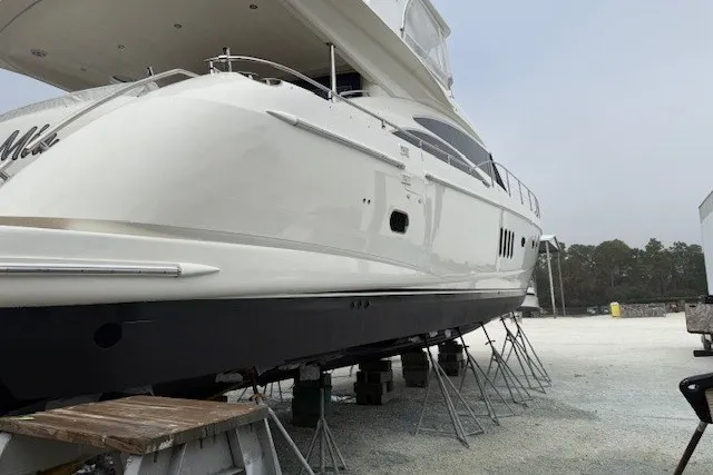 Slide: The Image of 2007 Princess 67 Flybridge Motor Yacht on stands, side view, outdoors. - 45