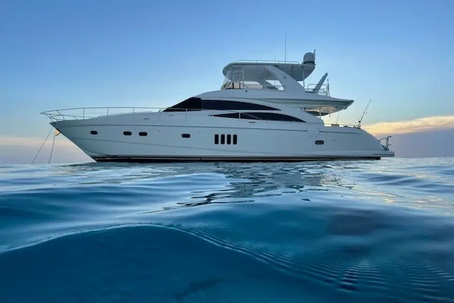 The Image of 2007 Princess 67 Flybridge Motor Yacht on calm ocean at sunset. - 0
