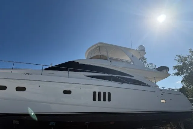 Slide: The Image of 2007 Princess 67 Flybridge Motor Yacht under bright sun, side view. - 37