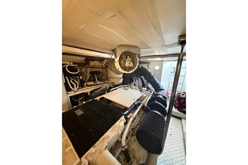 Slide: The Image of Engine room of 2007 Princess 67 Flybridge Motor Yacht, showcasing mechanical components and ventilation. - 32