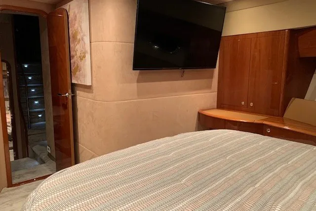 Slide: The Image of Luxurious bedroom interior of 2007 Princess 67 Flybridge Motor Yacht with TV and wood accents. - 25