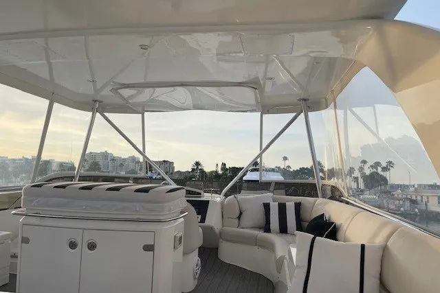 Slide: The Image of Luxurious 2007 Princess 67 Flybridge Motor Yacht with elegant seating and scenic views. - 18