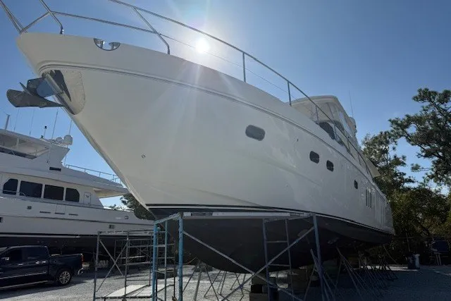 Slide: The Image of 2007 Princess 67 Flybridge Motor Yacht on stands, sunlit, with clear blue sky. - 40