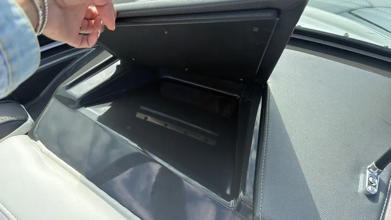 Slide: The Image of An open storage compartment on a 2020 Monterey 224FS boat. - 36