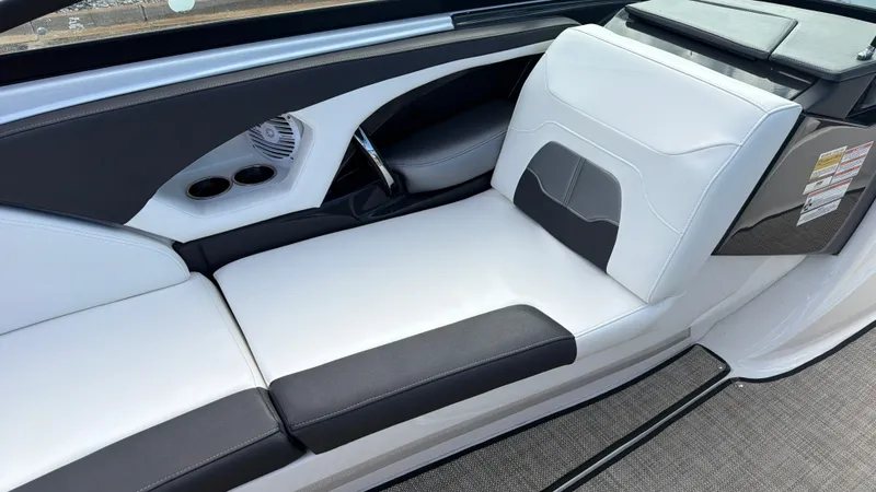 Slide: The Image of Interior of a 2020 Monterey 224FS boat with white and black seating. - 31
