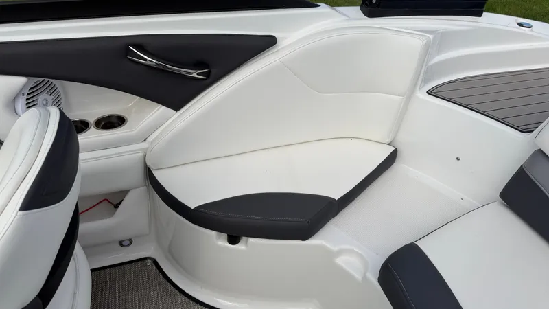 Slide: The Image of The image shows the interior of a 2020 Monterey 224FS boat with white and black seating. - 21