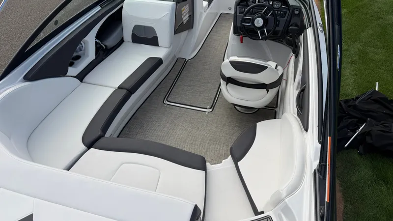 Slide: The Image of Interior of a 2020 Monterey 224FS with white and black seating and a modern helm. - 20