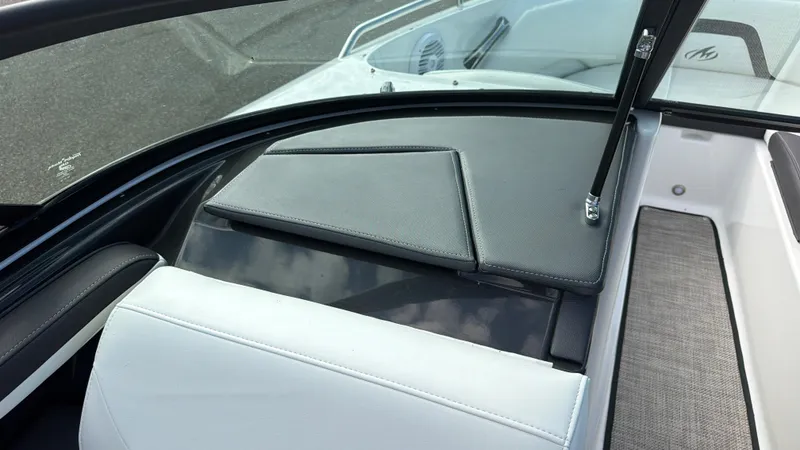 Slide: The Image of The image shows the cockpit of a 2020 Monterey 224FS boat with padded seating. - 35