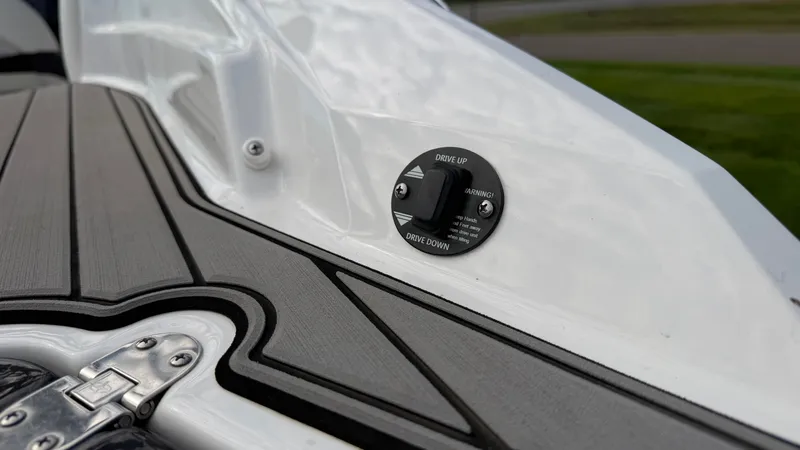 Slide: The Image of Close-up of a boat deck with a trim tab switch. - 16