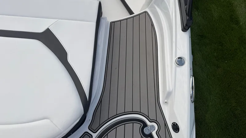Slide: The Image of Close-up of a Monterey 224FS boat deck with gray and black design. - 19