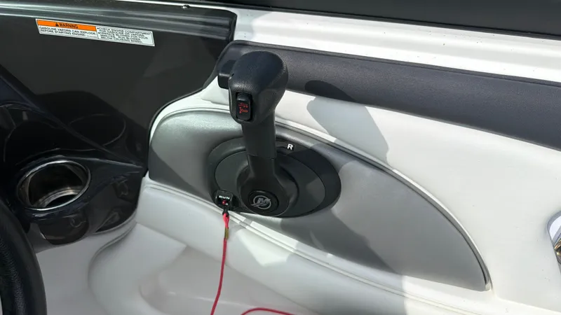 Slide: The Image of Close-up of the throttle lever on a 2020 Monterey 224FS boat. - 39