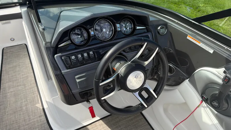 Slide: The Image of The image shows the cockpit of a 2020 Monterey 224FS boat with a modern dashboard. - 41
