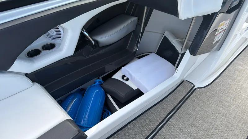 Slide: The Image of Interior of a Monterey 224FS boat with blue fenders and seating. - 34
