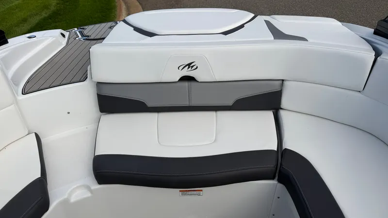 Slide: The Image of The 2020 Monterey 224FS features a stylish, cushioned seating area with gray and white accents. - 22