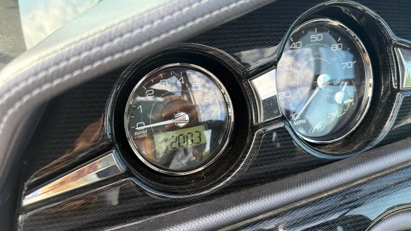 Slide: The Image of Close-up of a 2020 Monterey 224FS boat dashboard with speedometers. - 45