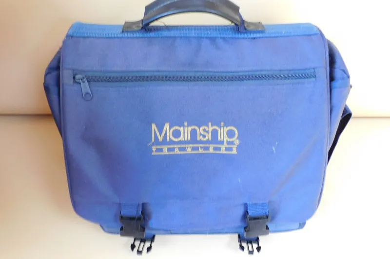 Slide: The Image of Blue Mainship travel bag with logo, related to 2004 Pilot 30 Rum Runner. - 45