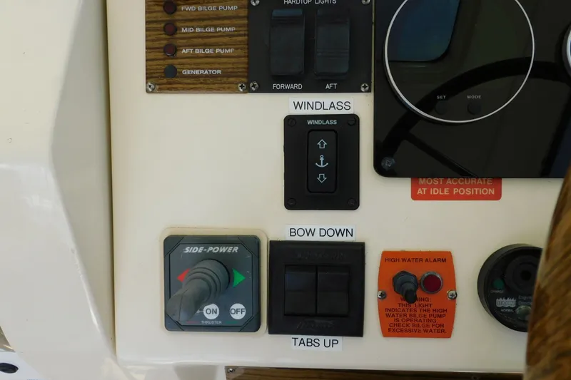 Slide: The Image of Control panel of a 2004 Mainship Pilot 30 Rum Runner boat. - 19