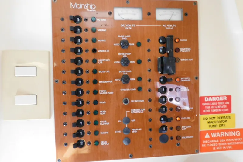 Slide: The Image of Electrical control panel of a 2004 Mainship Pilot 30 Rum Runner boat. - 33