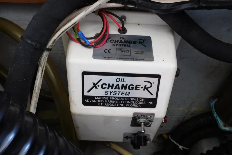 Slide: The Image of Oil X-Change-R system in 2004 Mainship Pilot 30 Rum Runner boat engine compartment. - 40