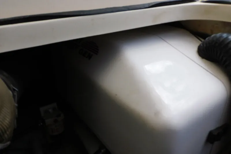 Slide: The Image of Engine compartment of a 2004 Mainship Pilot 30 Rum Runner boat. - 41