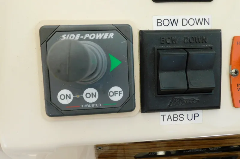Slide: The Image of Control panel of a 2004 Mainship Pilot 30 Rum Runner with thruster and bow controls. - 17
