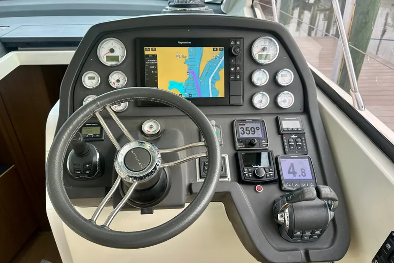 Slide: The Image of Cockpit of 2015 Azimut Atlantis 38 yacht with navigation controls and display. - 11
