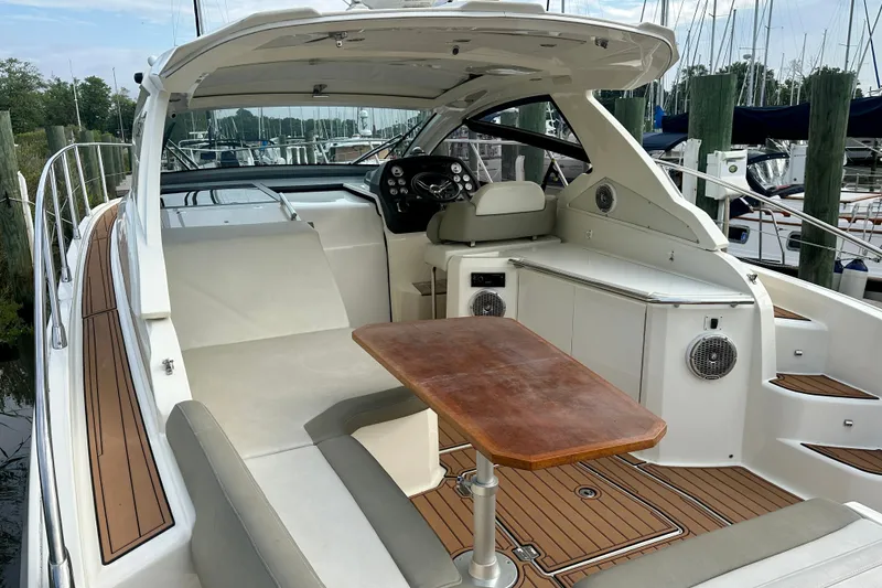 Slide: The Image of 2015 Azimut Atlantis 38 yacht interior with seating, table, and helm station. - 6