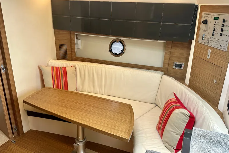 Slide: The Image of Interior of 2015 Azimut Atlantis 38 yacht with cozy seating and wooden table. - 15