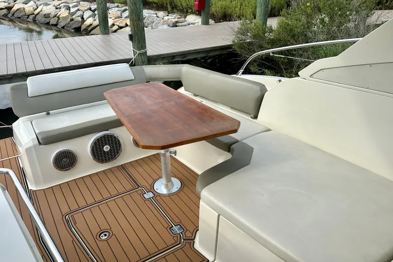 Slide: The Image of Azimut Atlantis 38 yacht deck with seating and wooden table, 2015 model. - 8