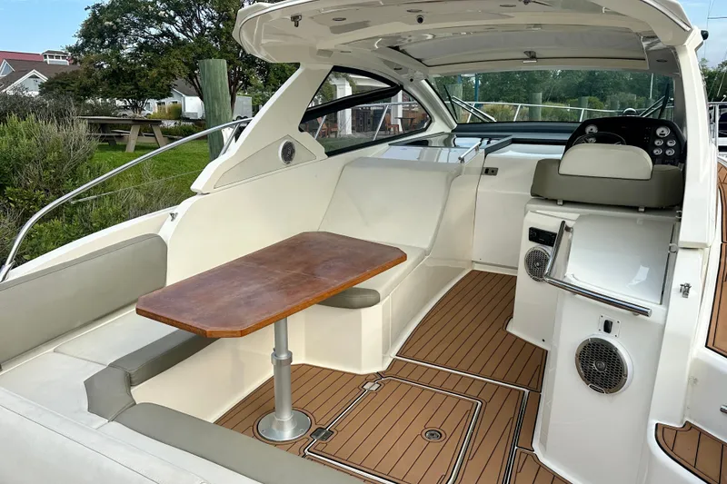 Slide: The Image of 2015 Azimut Atlantis 38 yacht interior with seating and wooden table. - 7
