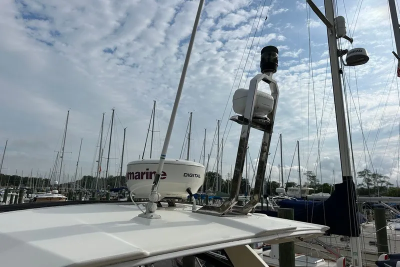 Slide: The Image of 2015 Azimut Atlantis 38 yacht with radar equipment in a marina setting. - 20