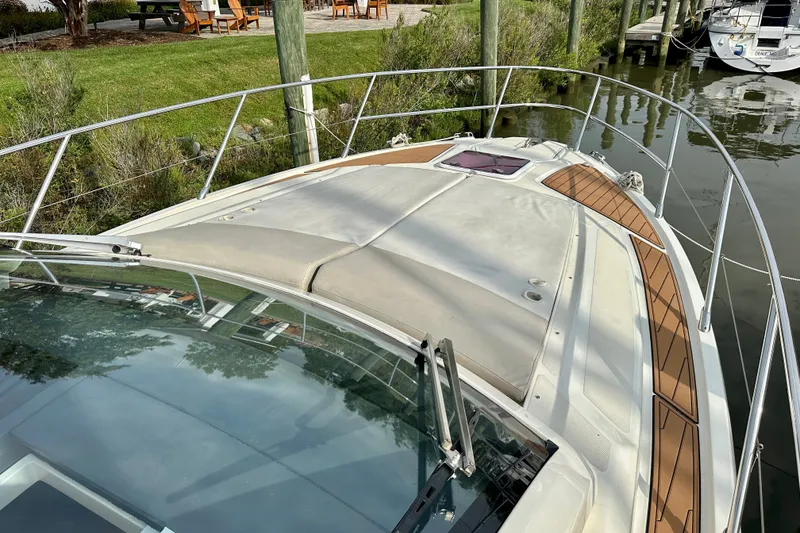 Slide: The Image of Azimut Atlantis 38 yacht, 2015 model, docked with sleek deck design and railing. - 5