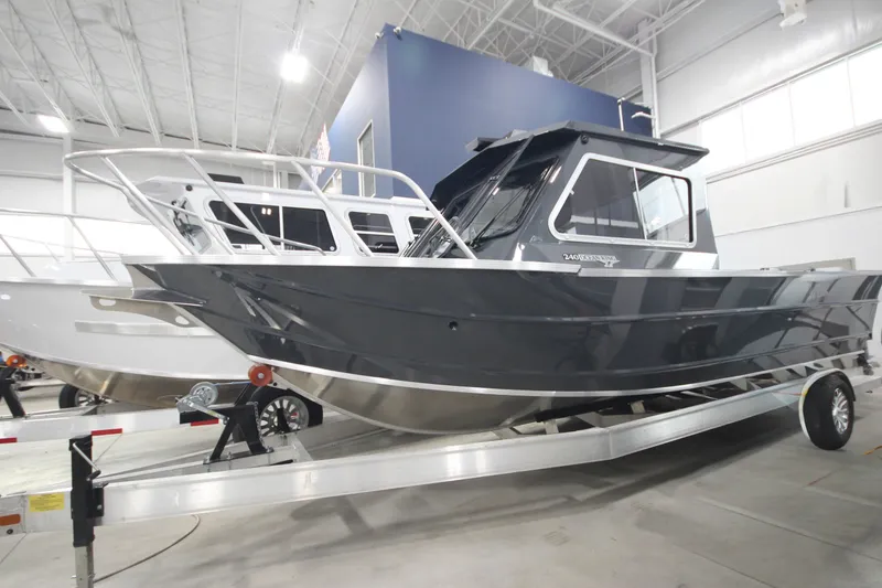 Slide: The Image of 2027 Weldcraft 240 Ocean King boat on trailer in showroom. - 1