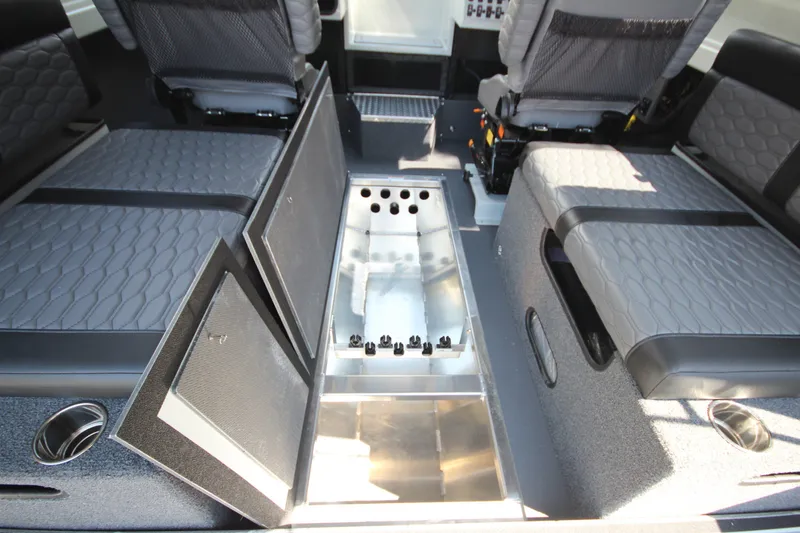 Slide: The Image of Interior of 2027 Weldcraft 240 Ocean King boat with seating and storage compartments. - 31