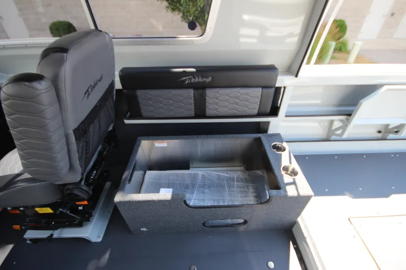 Slide: The Image of Interior of 2027 Weldcraft 240 Ocean King boat with seating and storage compartment. - 24