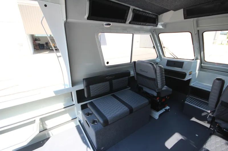 Slide: The Image of Interior of 2027 Weldcraft 240 Ocean King boat with seating and windows. - 21